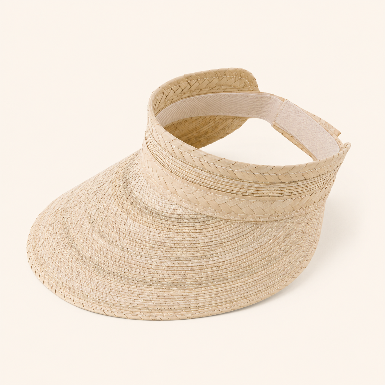 Beige straw visor on a white background