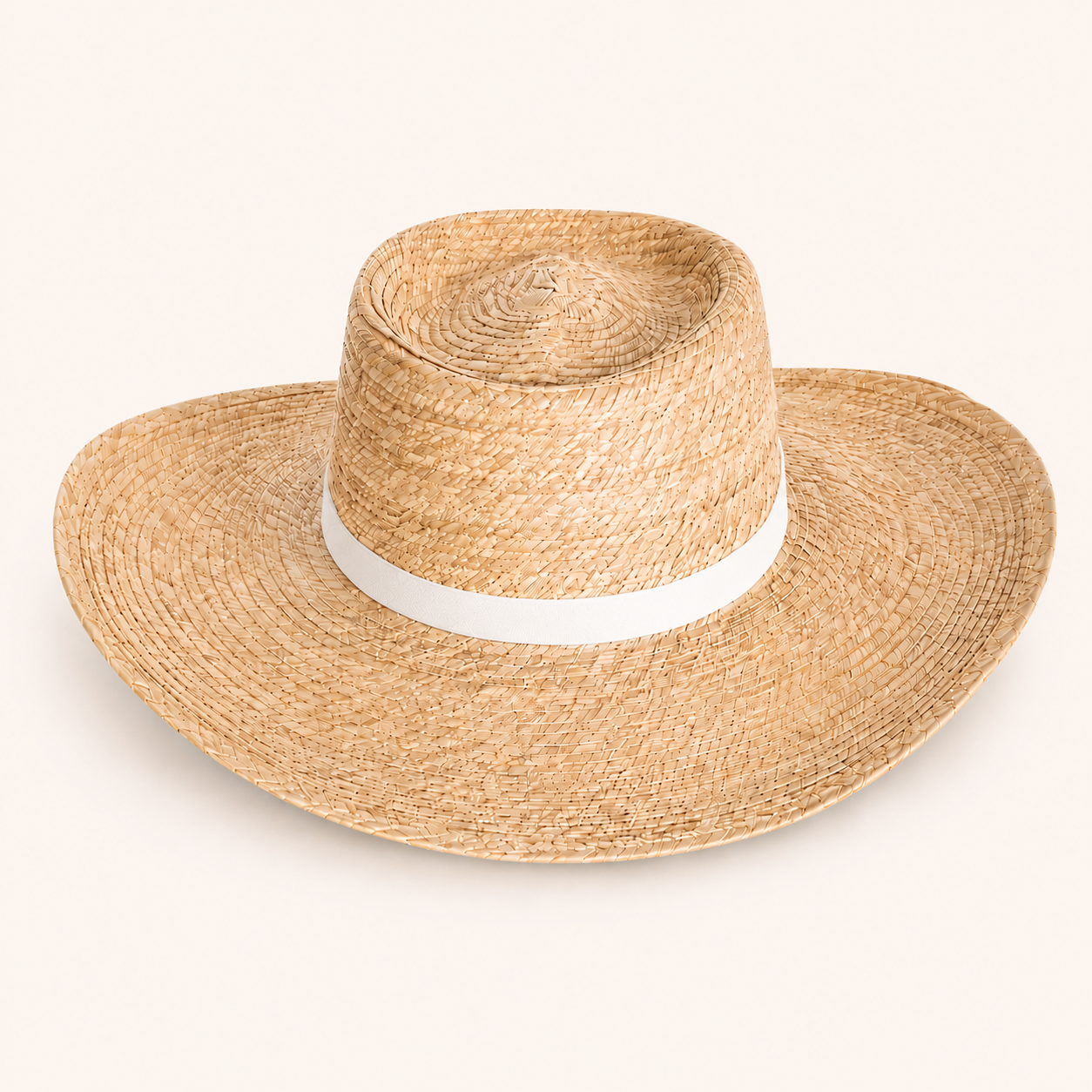 Straw hat with a white band on a light gray background