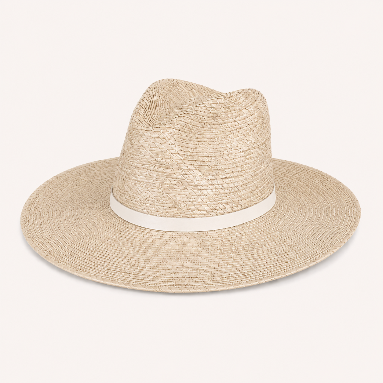 Beige straw hat with a white band on a light beige background