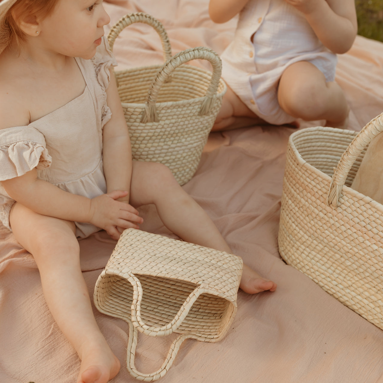 California inspired mini straw baskets designed by Leah, sustainably handmade by artisans